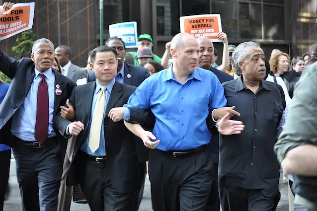 John Liu marches on Wall Street with Manhattan Borough President Scott Stringer and Al Sharpton back in May